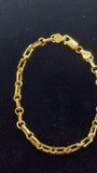 Bracelet trombone et chaîne rolo en or