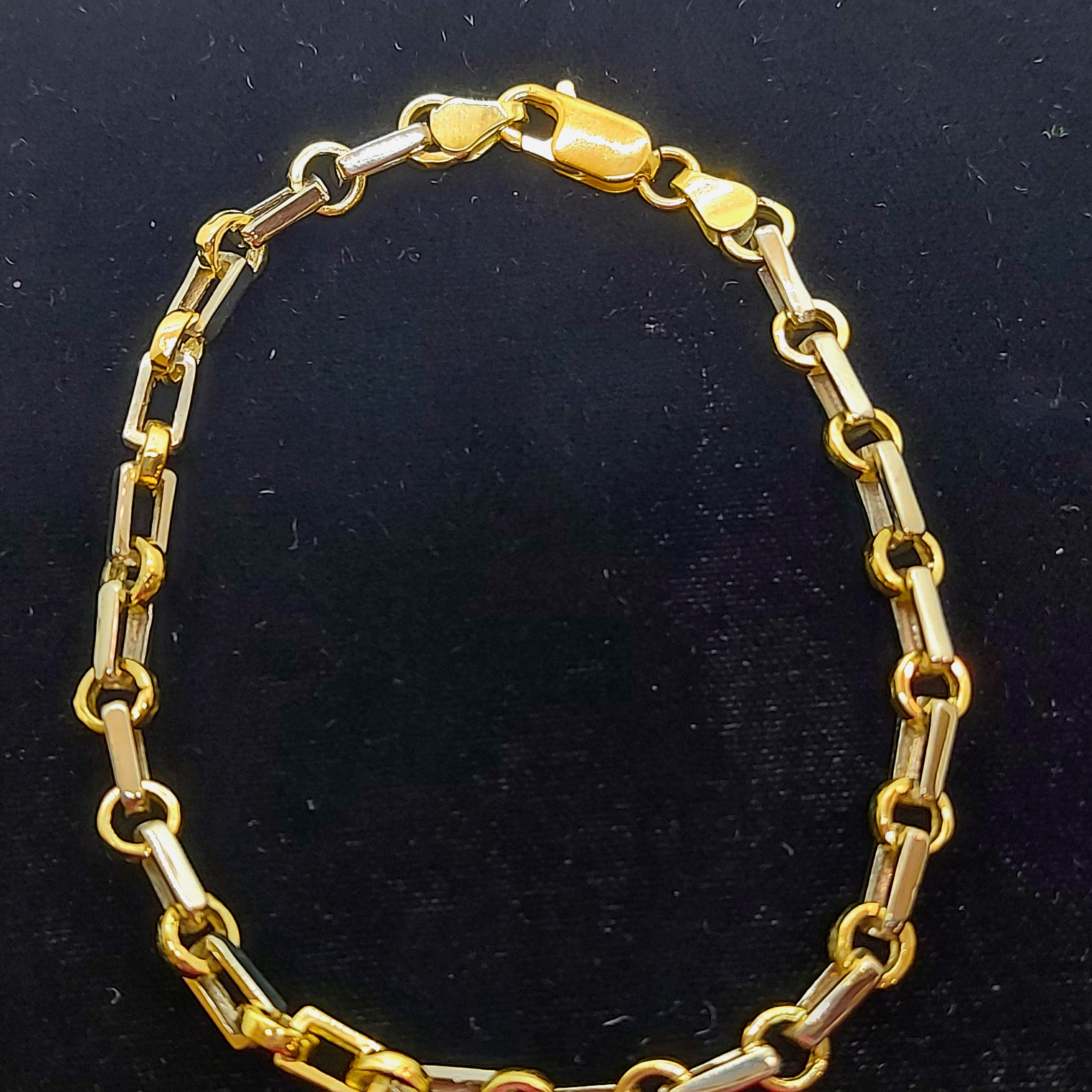 Bracelet en or bicolore avec maillons trombone et rolo