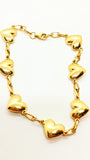 Bracelet en or 10 carats avec cœurs