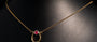 Collier fer à cheval rubis serti clos or 14K