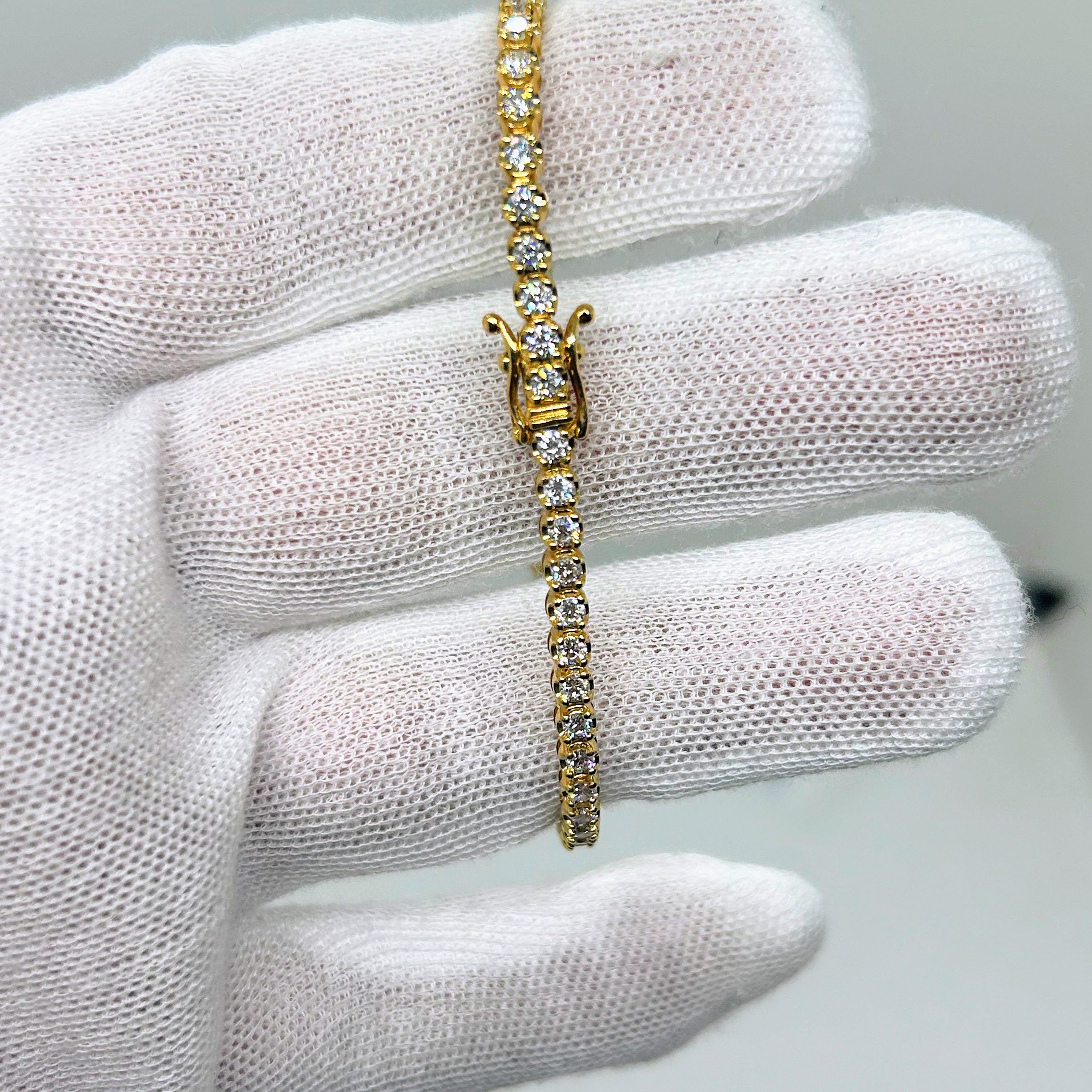 Bracelet tennis en or 14 carats 5 points