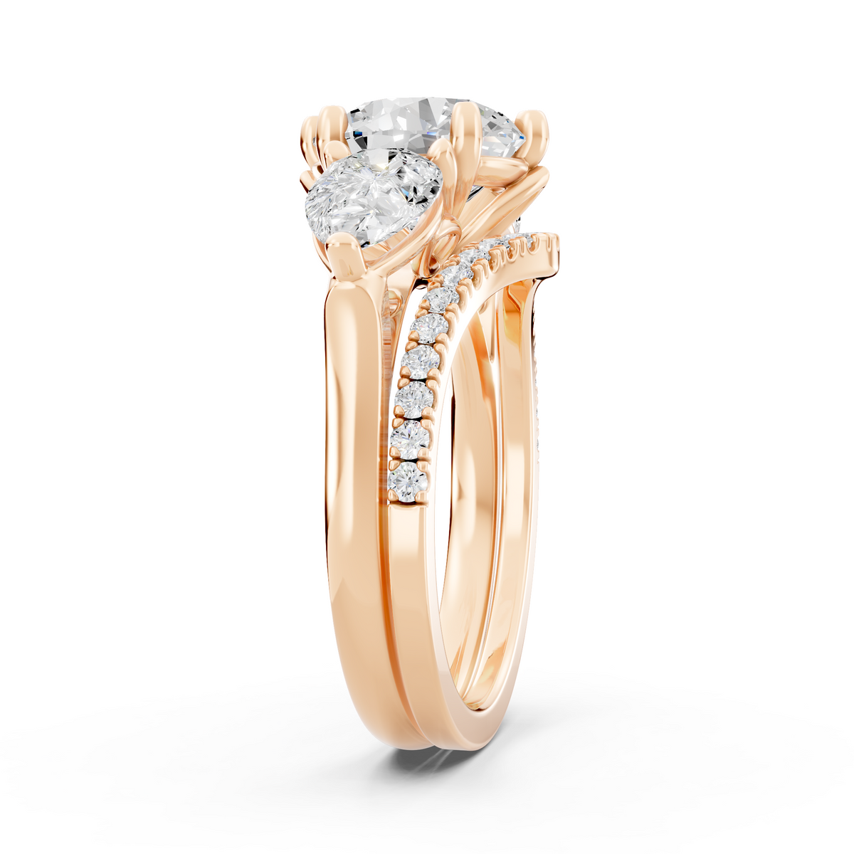 Three stone Ring with Pear shape sides and matching wedding ring.