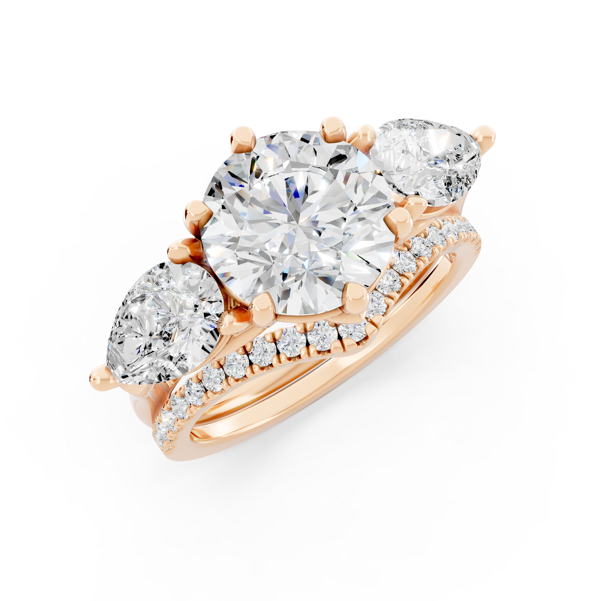 Three stone Ring with Pear shape sides and matching wedding ring.