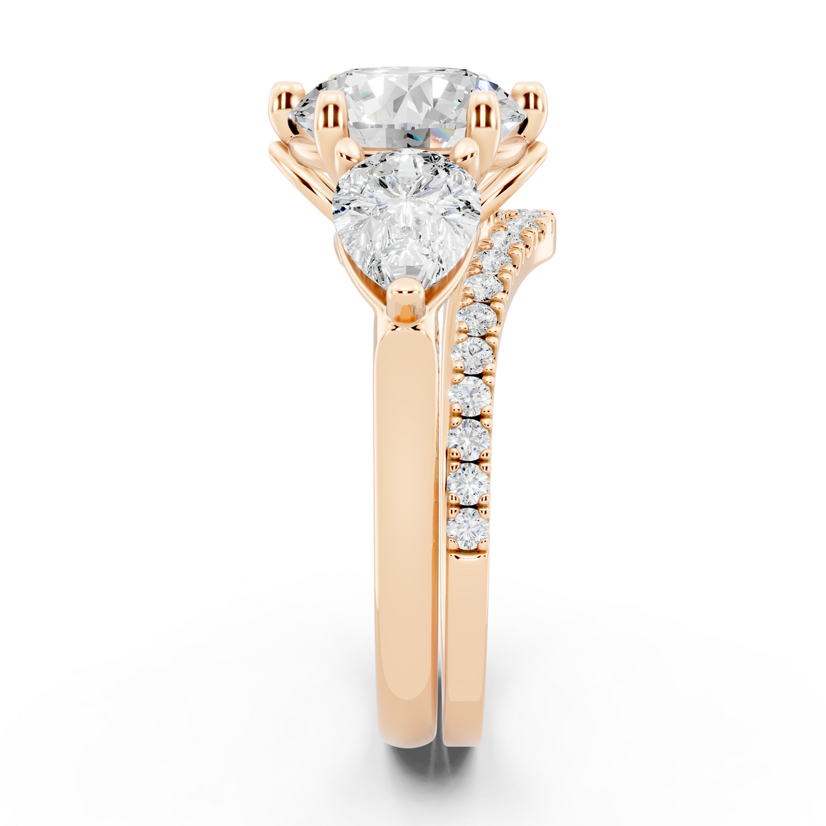 Three stone Ring with Pear shape sides and matching wedding ring.