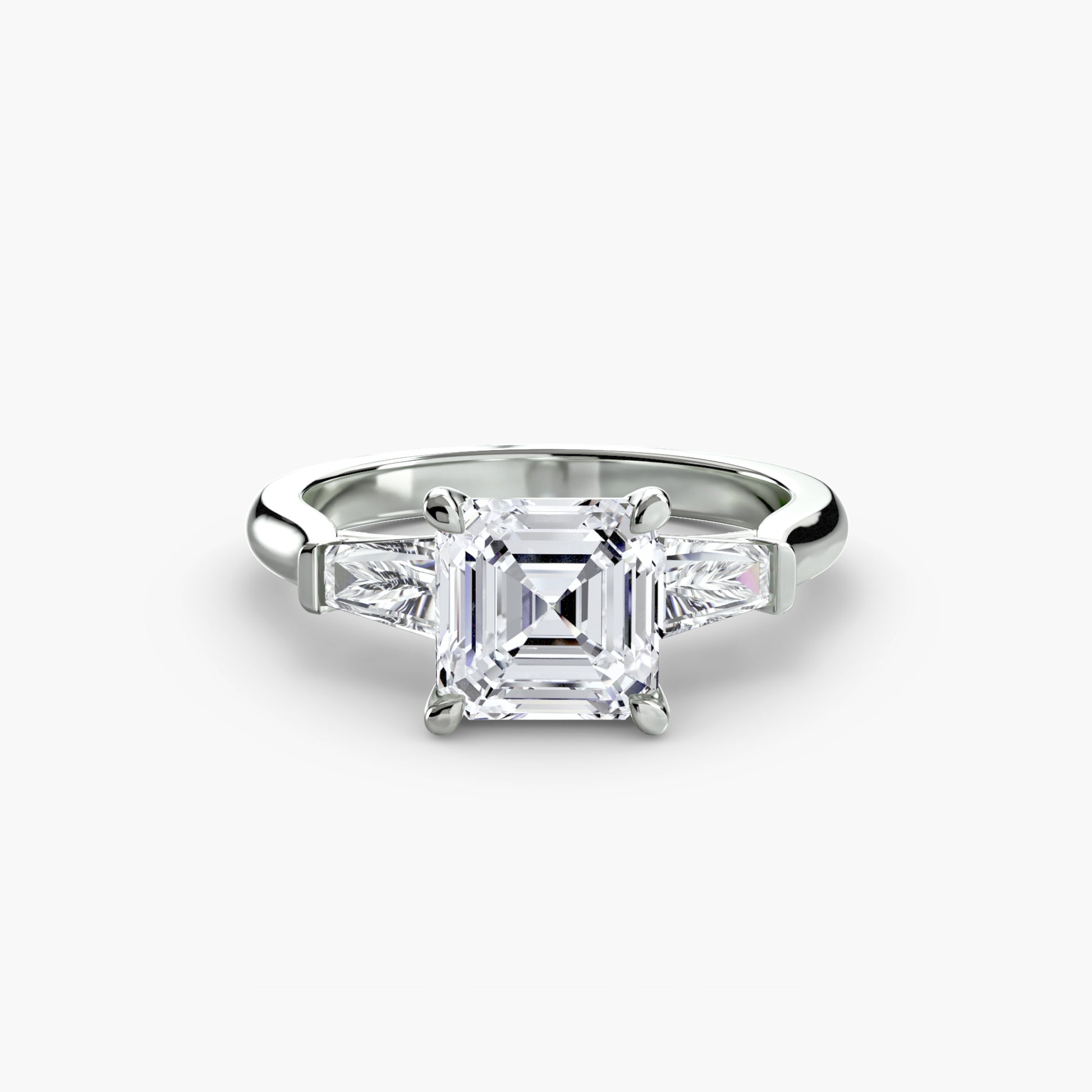 Bague trilogie (pierres latérales baguette)