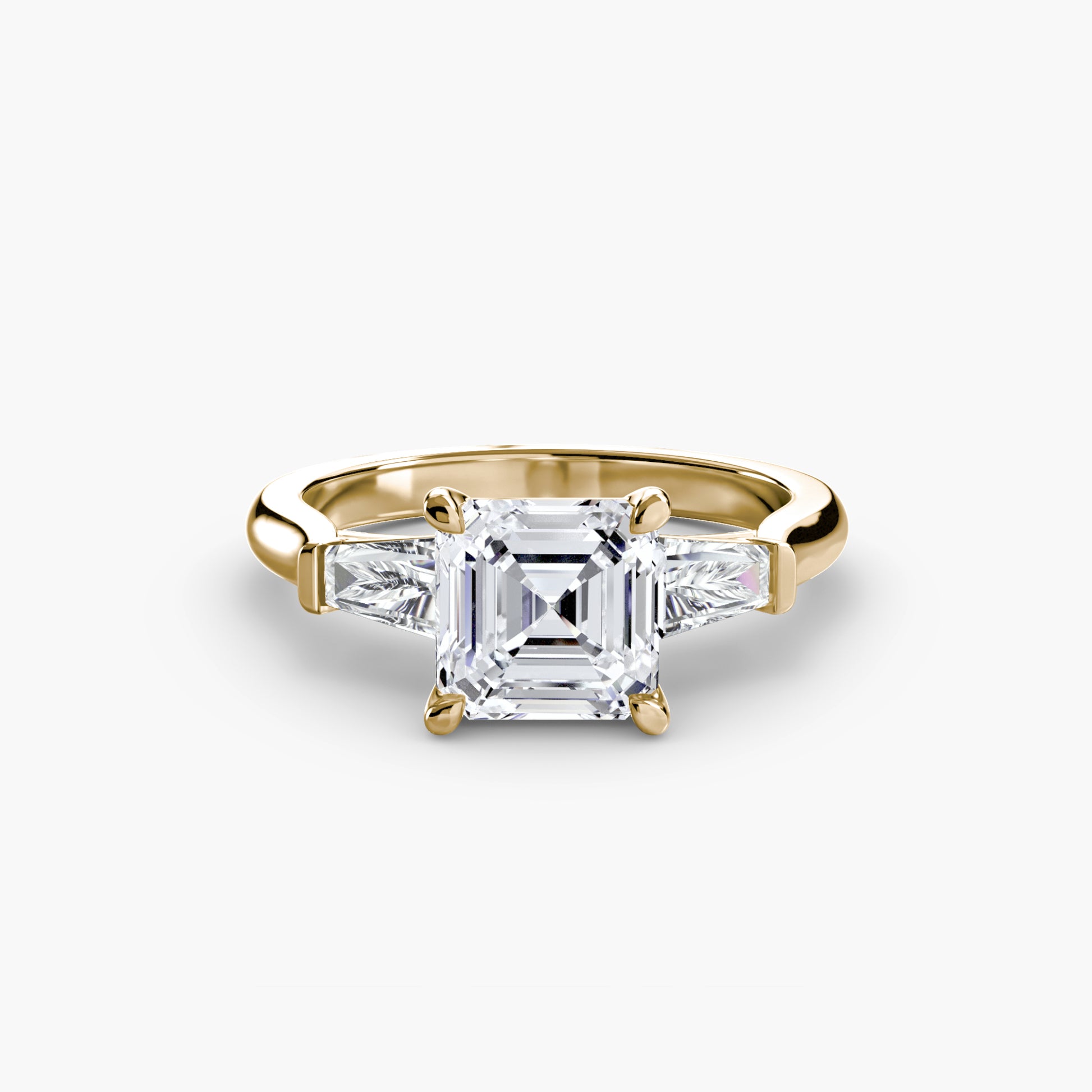 Bague trilogie (pierres latérales baguette)