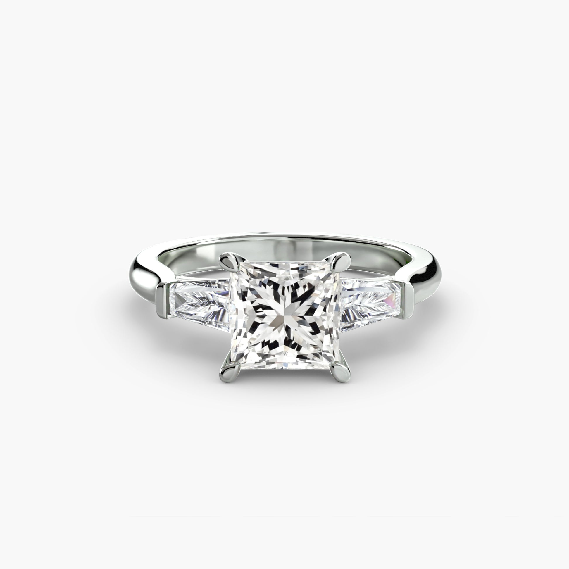 Bague trilogie (pierres latérales baguette)