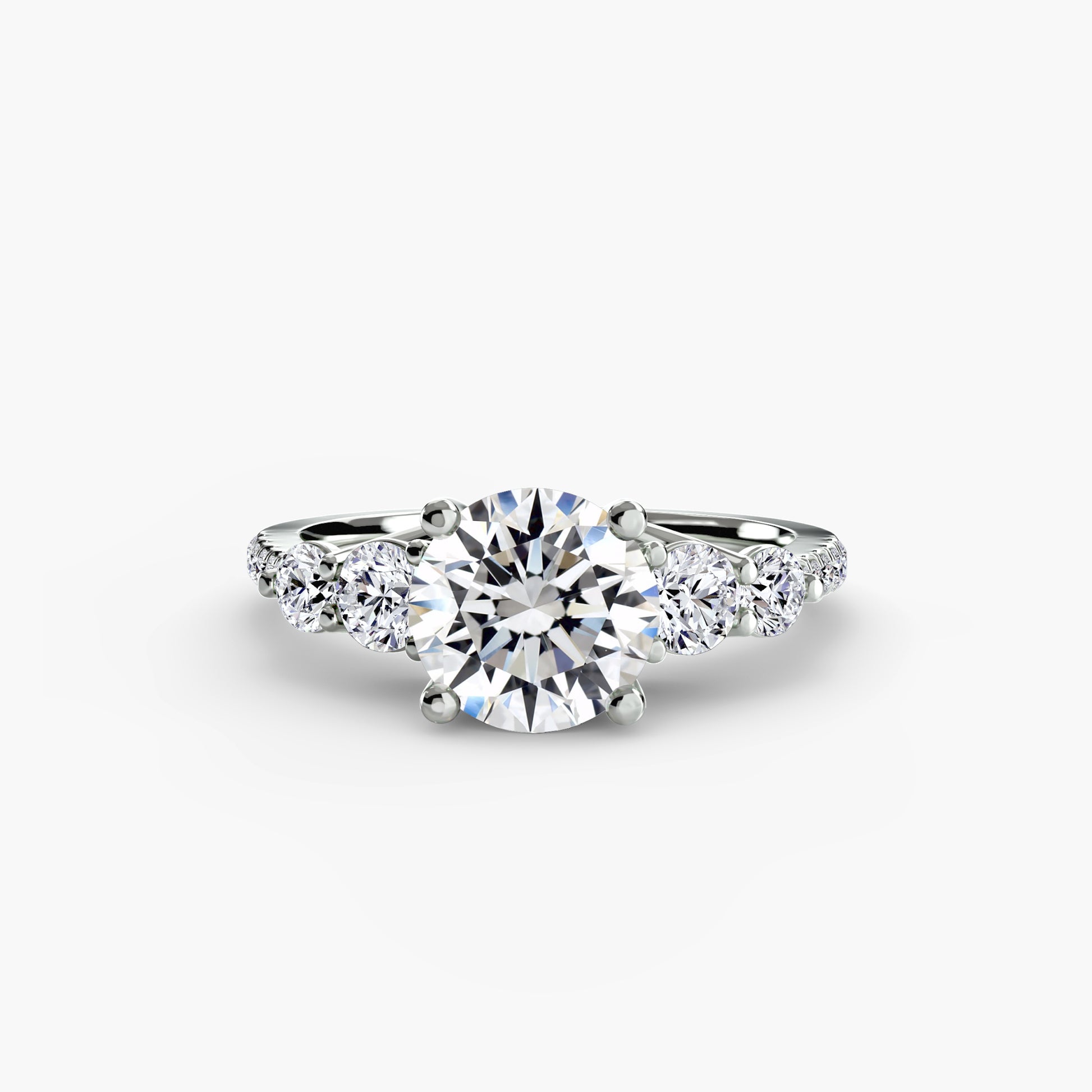 Bague cinq pierres avec anneau pavé