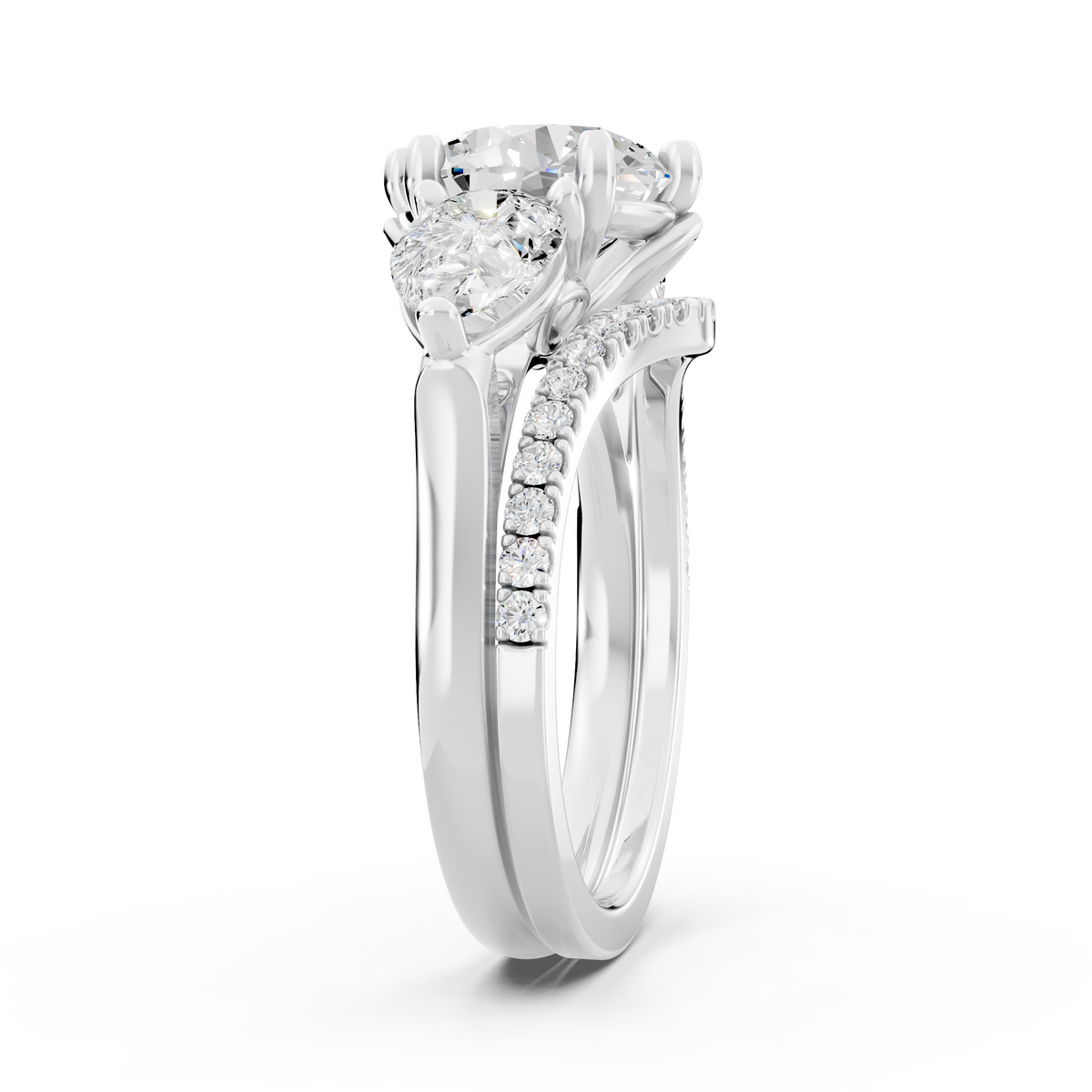 Three stone Ring with Pear shape sides and matching wedding ring.