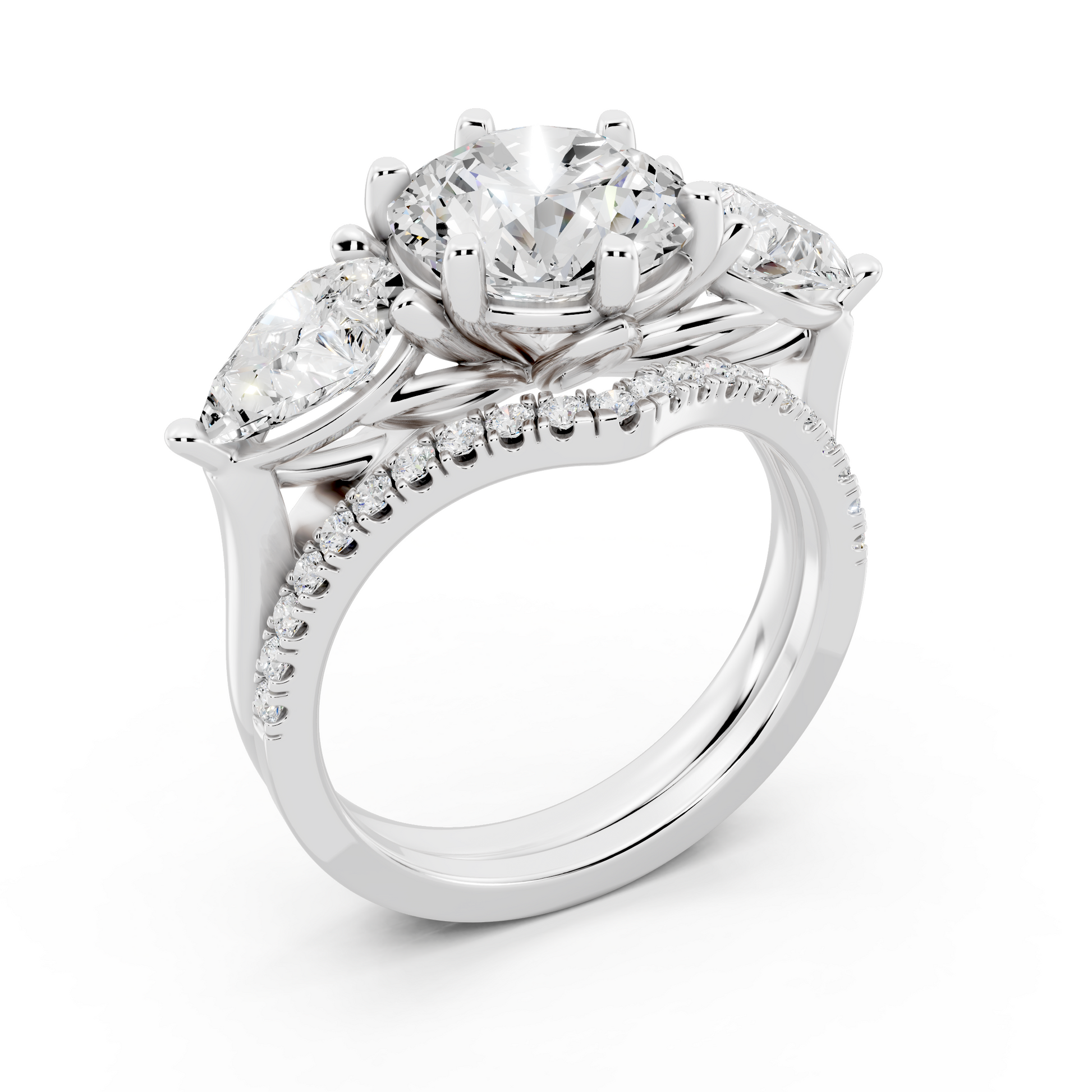 Three stone Ring with Pear shape sides and matching wedding ring.