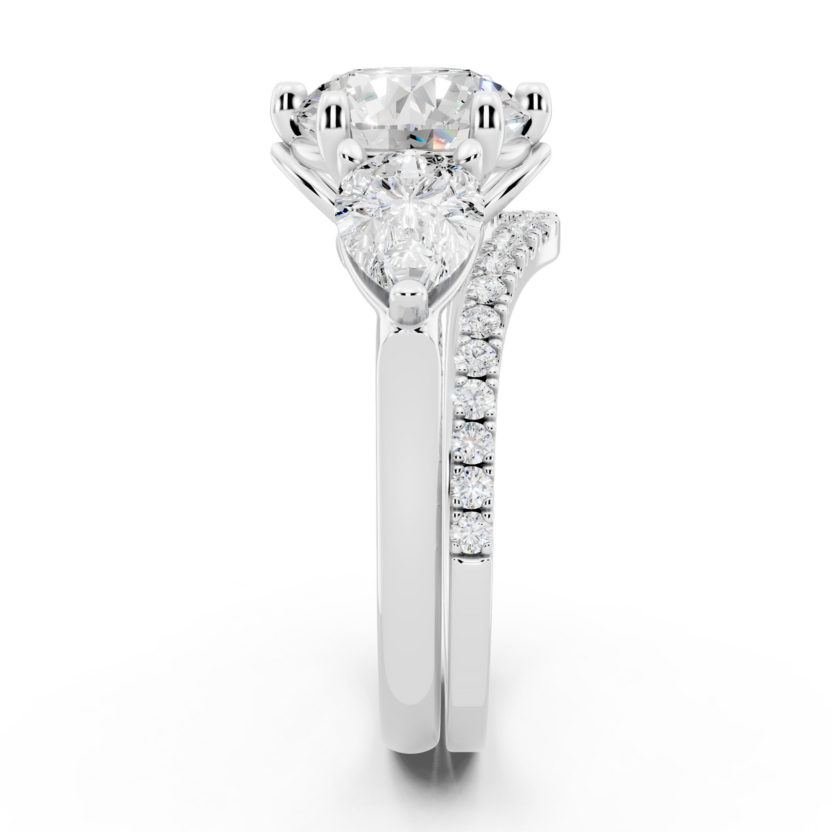 Three stone Ring with Pear shape sides and matching wedding ring.