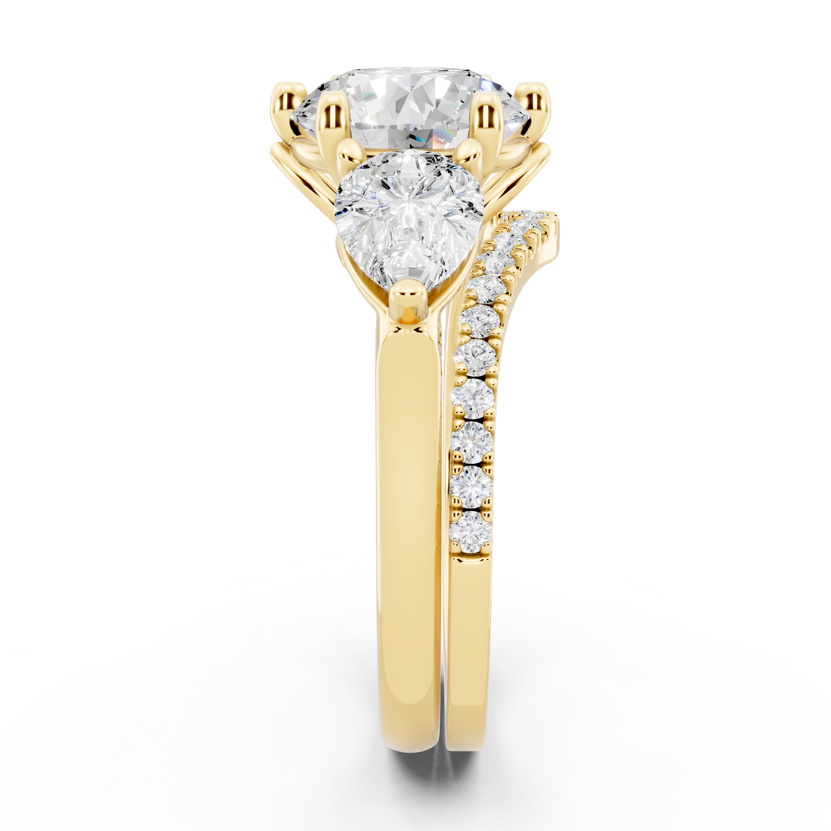 Three stone Ring with Pear shape sides and matching wedding ring.