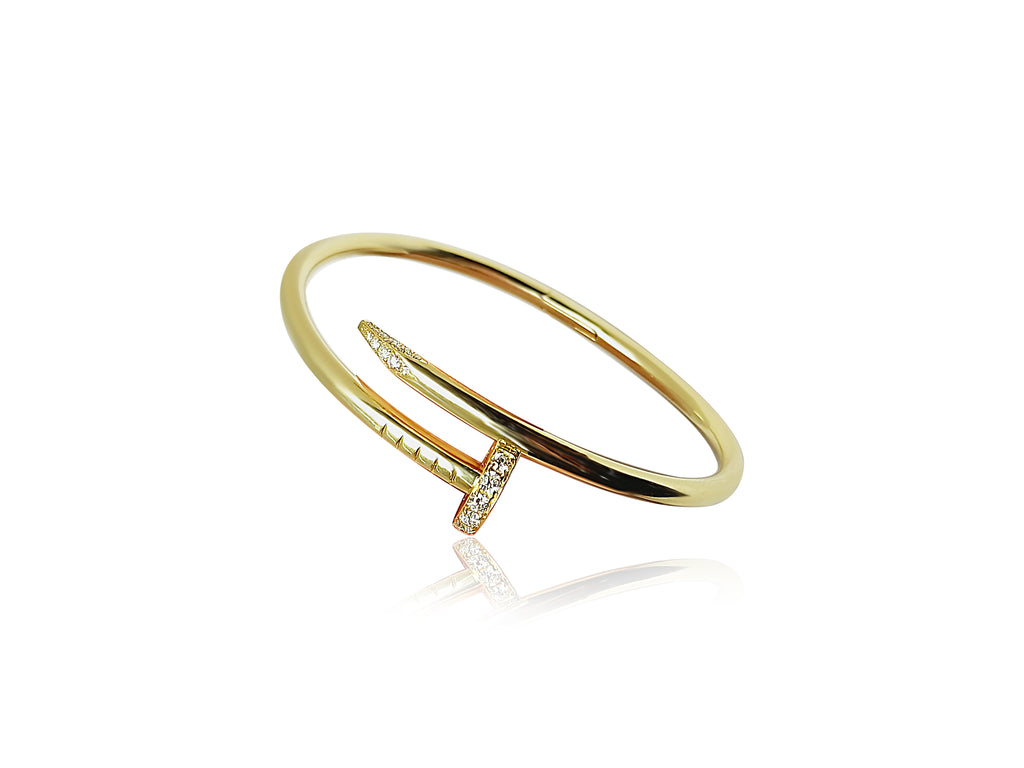 Front-facing titled 18k gold bangle bracelet