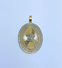 Pendentif ovale en or à tête Versace réfléchissante