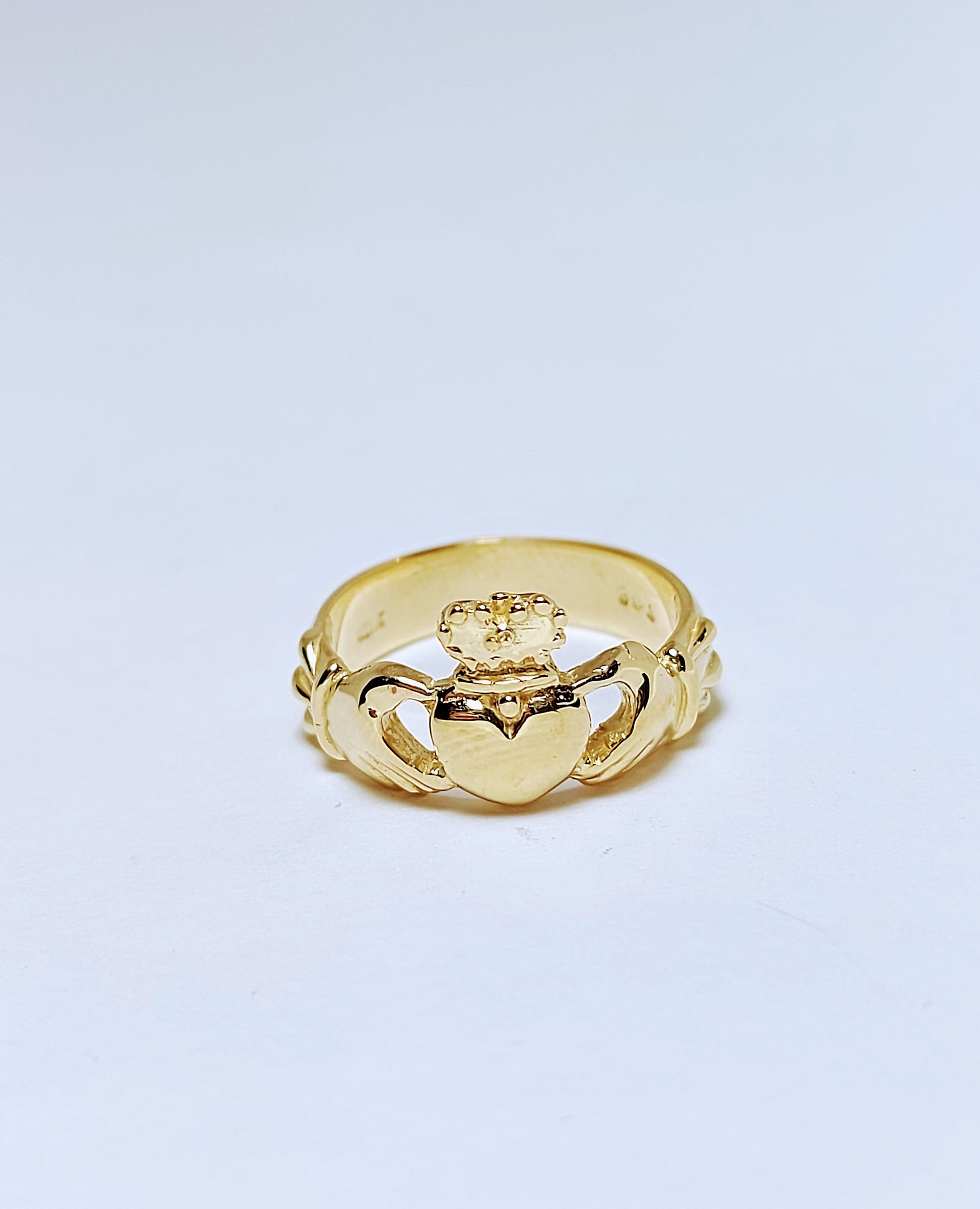 Gold ring with crown and heart