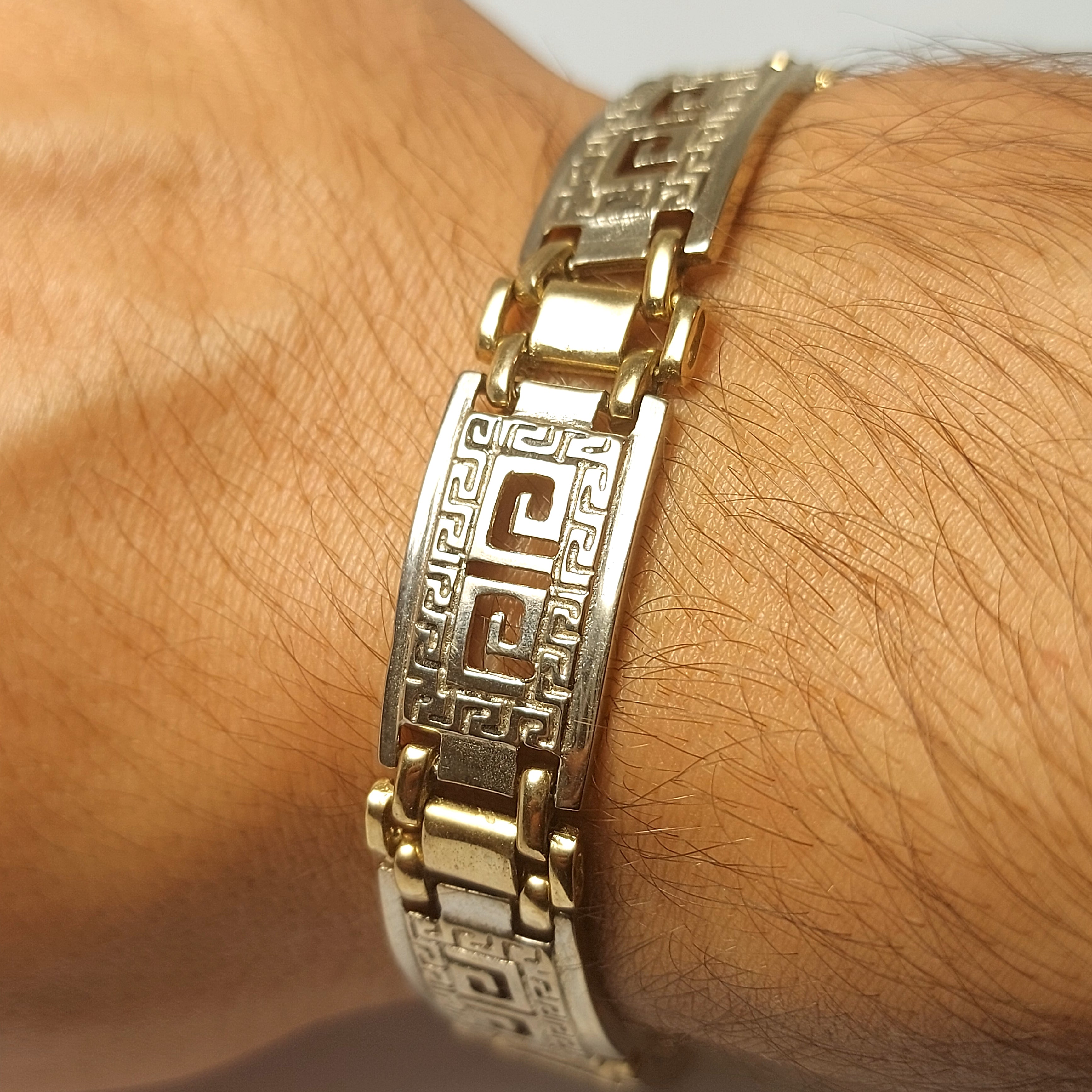 Men's gold bracelet with g lock and Greek design